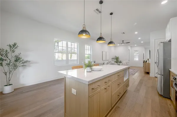 a view of a livingroom with furniture and wooden floor