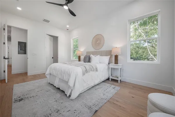 a bathroom with a double vanity sink a toilet and a mirror