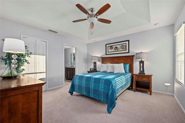 a bedroom with a bed and a table in it