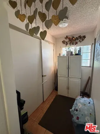a bathroom with a refrigerator and a stove