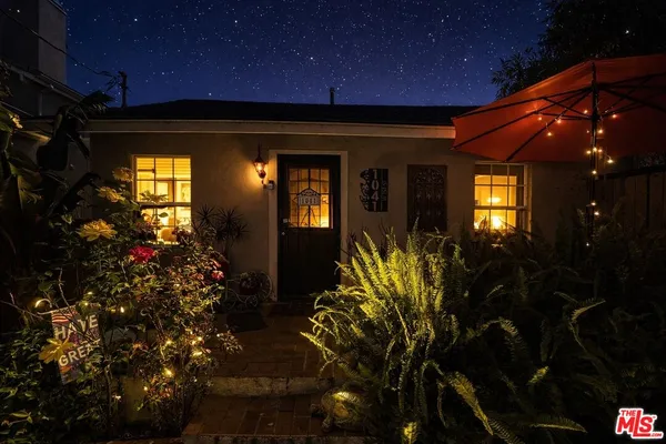 a view of a entryway door of the house and front view of a house