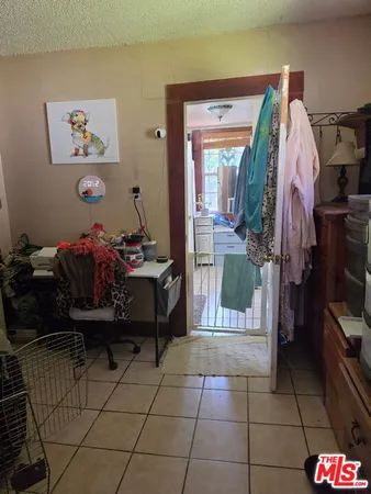 a room with furniture and a flat screen tv