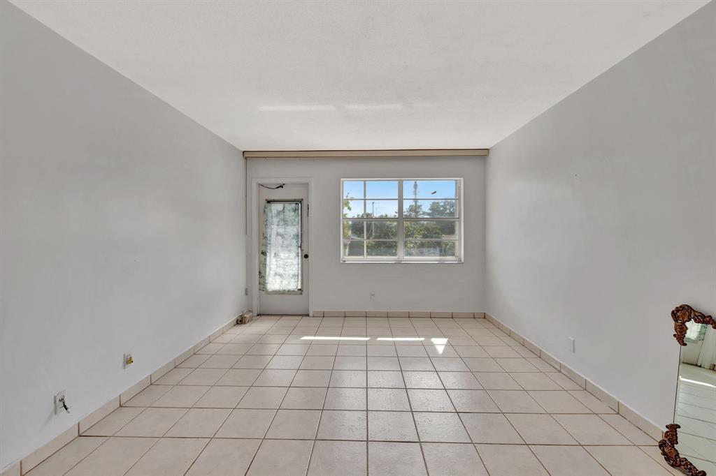 4310 Northwest 12th Court Lauderhill, FL 33313 - Photo 11 of 29 an empty room with windows