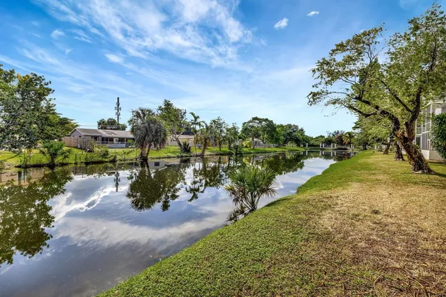 a view of a lake with a yard