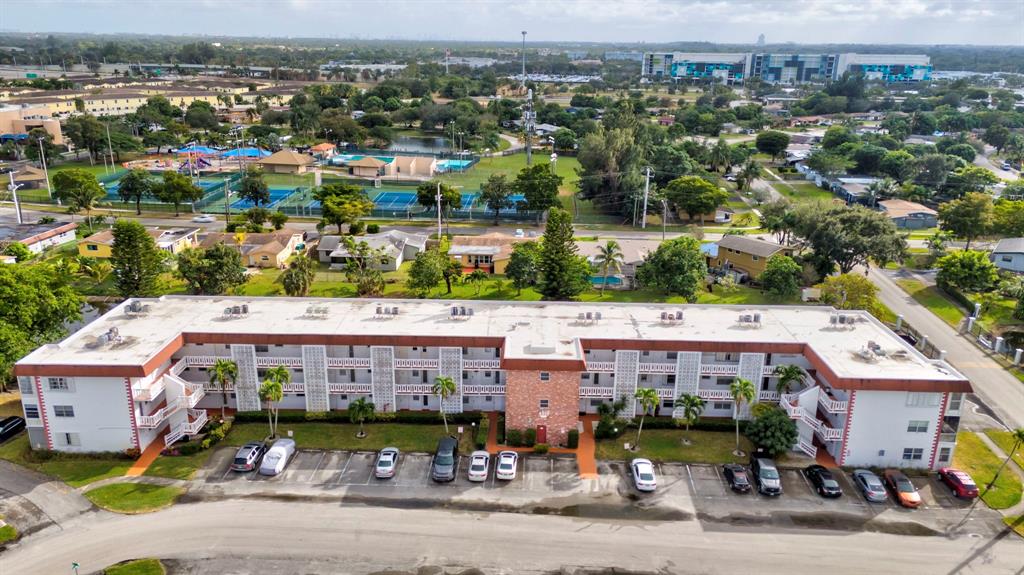 4310 Northwest 12th Court Lauderhill, FL 33313 - Photo 20 of 29 an aerial view of a house with a garden and lake view