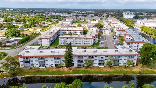 an aerial view of residential building and lake
