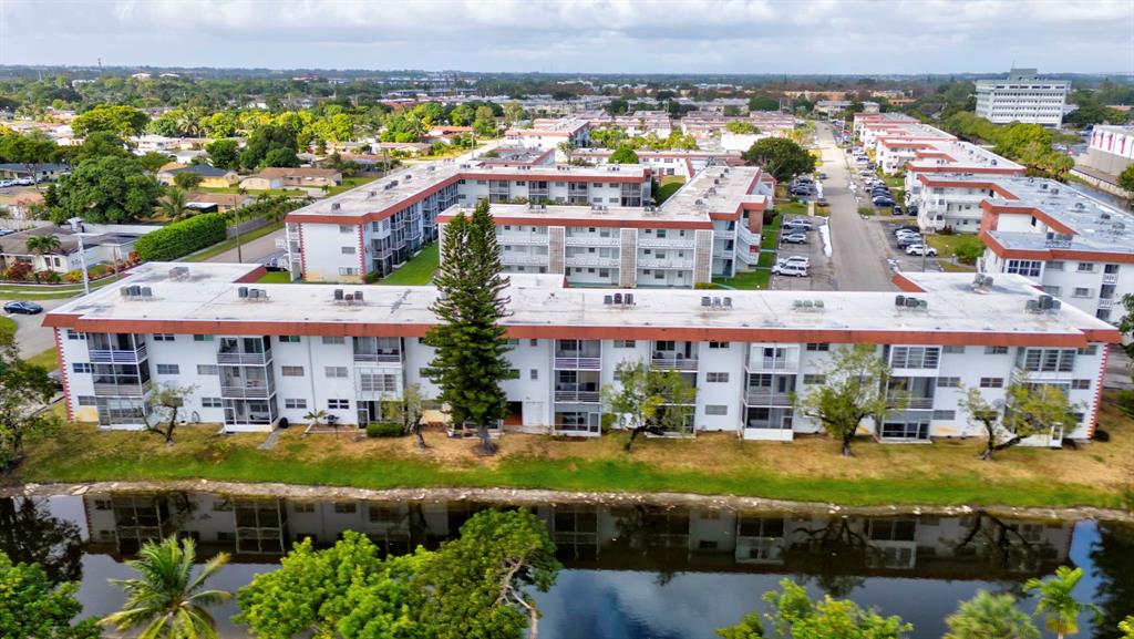 4310 Northwest 12th Court Lauderhill, FL 33313 - Photo 28 of 29 an aerial view of a building with a garden and lake view