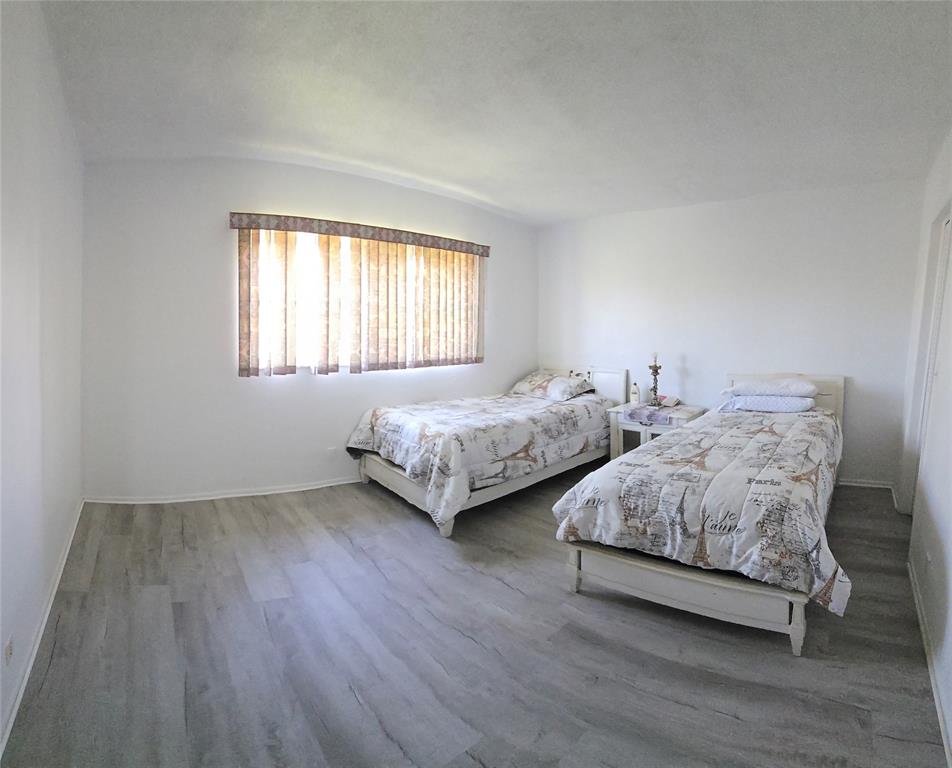 4310 Northwest 12th Court Lauderhill, FL 33313 - Photo 4 of 29 a bedroom with two beds and a night stand