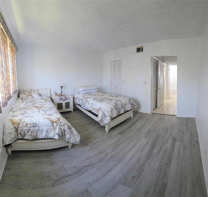 4310 Northwest 12th Court Lauderhill, FL 33313 - Photo 6 of 29 a spacious bedroom with two beds and a window