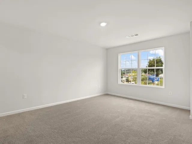 a view of a floor to ceiling window and an outdoor view