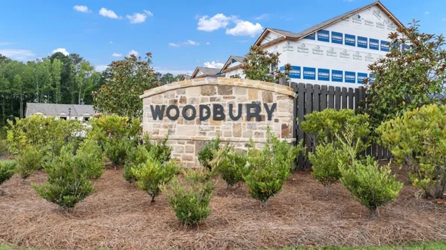 a view of a hallway with the wooden floor and staircase