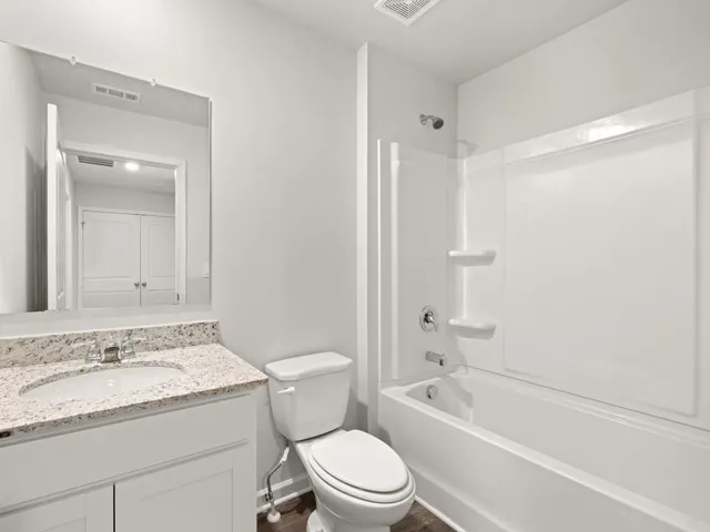 a view of a swimming pool and trees in the background