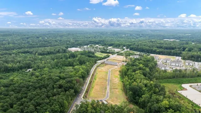 a view of house with outdoor space and sitting area