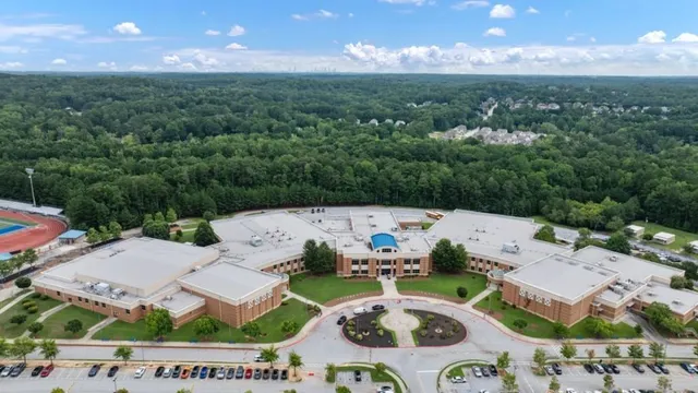 a view of a fireplace with a table and chairs
