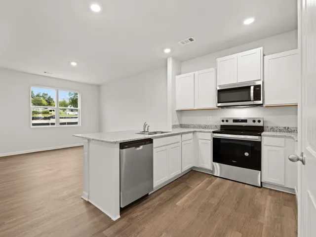 a view of kitchen with wooden floor