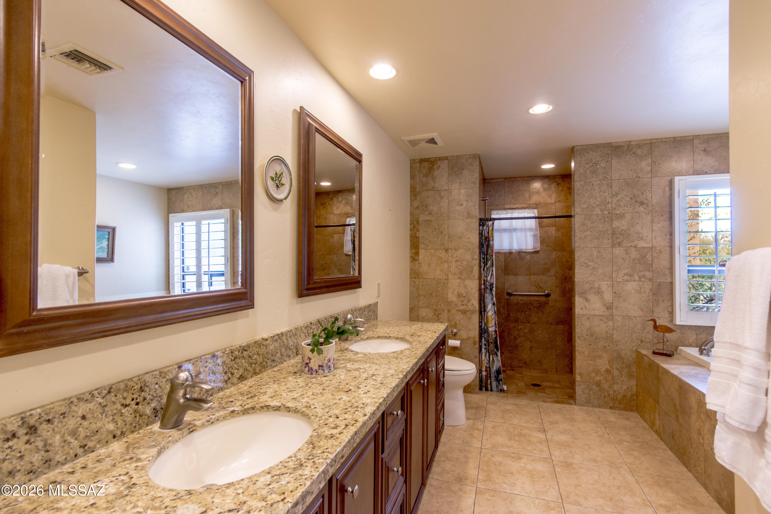 720 East Rudasill Road Tucson, AZ 85718 - Photo 44 of 48 Guest suite, double sinks, granite counter-tops, jetted tub, wheel chair access to shower.