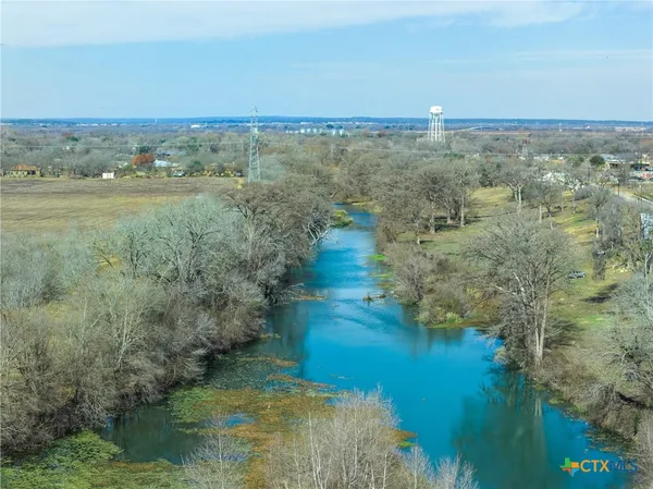 a view of a lake with a yard