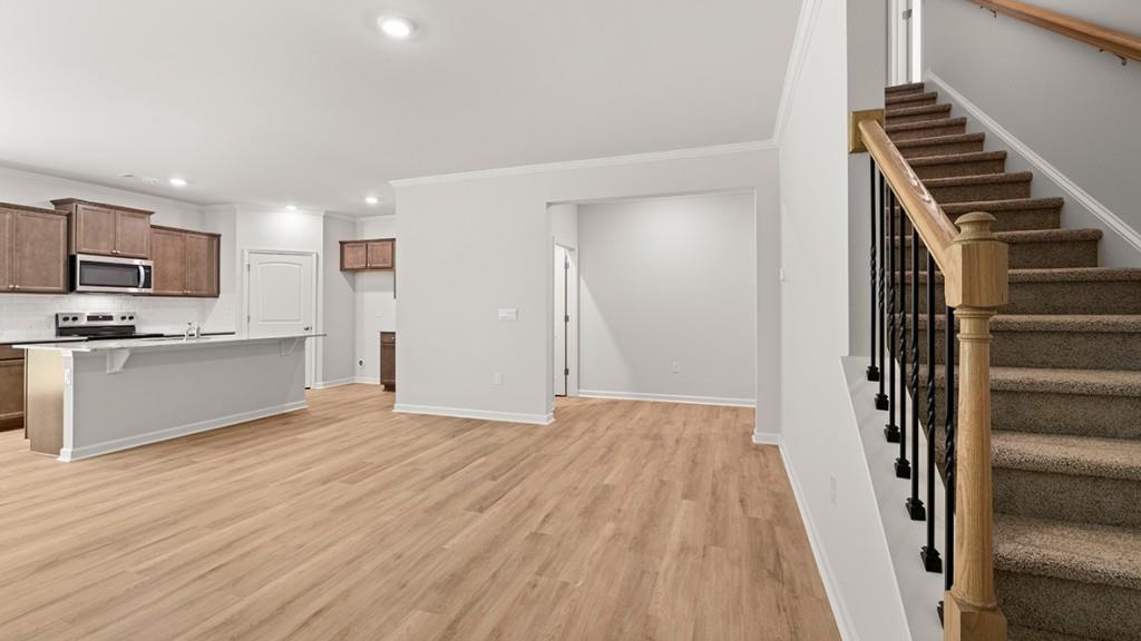 3277 Ryker Road Gainesville, GA 30507 - Photo 13 of 54 a view of kitchen with wooden floor electronic appliances and stairs