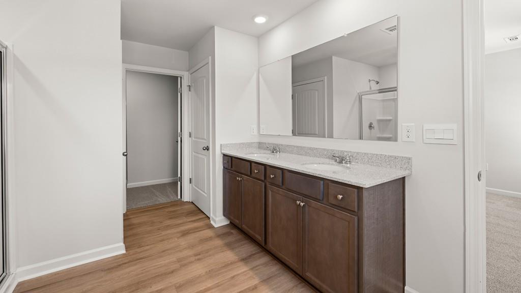 3277 Ryker Road Gainesville, GA 30507 - Photo 18 of 54 a bathroom with a sink and a mirror