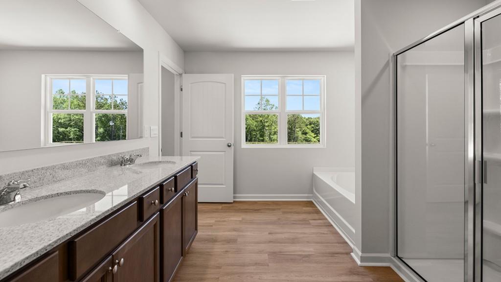 3277 Ryker Road Gainesville, GA 30507 - Photo 19 of 54 a bathroom with a granite countertop sink and a window