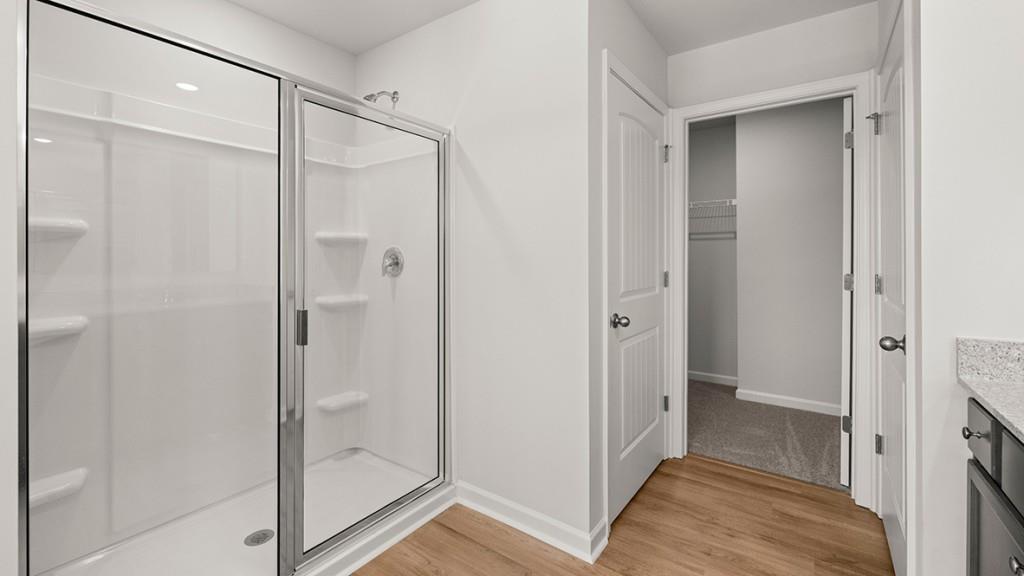 3277 Ryker Road Gainesville, GA 30507 - Photo 21 of 54 a bathroom with a glass shower door