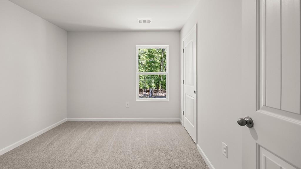 3277 Ryker Road Gainesville, GA 30507 - Photo 31 of 54 a view of an empty room with a window