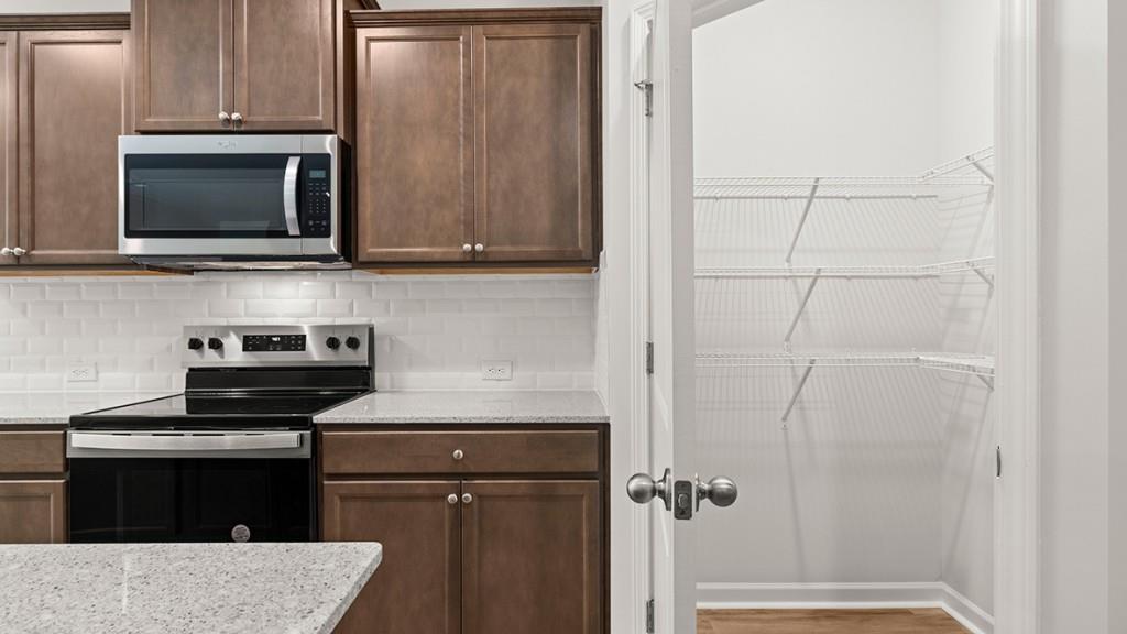 3277 Ryker Road Gainesville, GA 30507 - Photo 9 of 54 a kitchen with a refrigerator stove and microwave