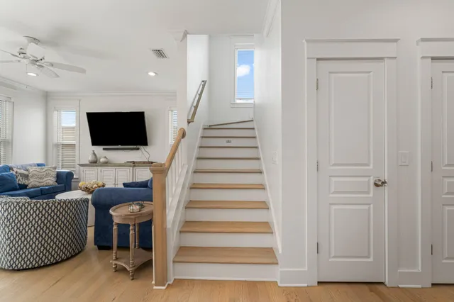 a view of a livingroom with furniture and stairs