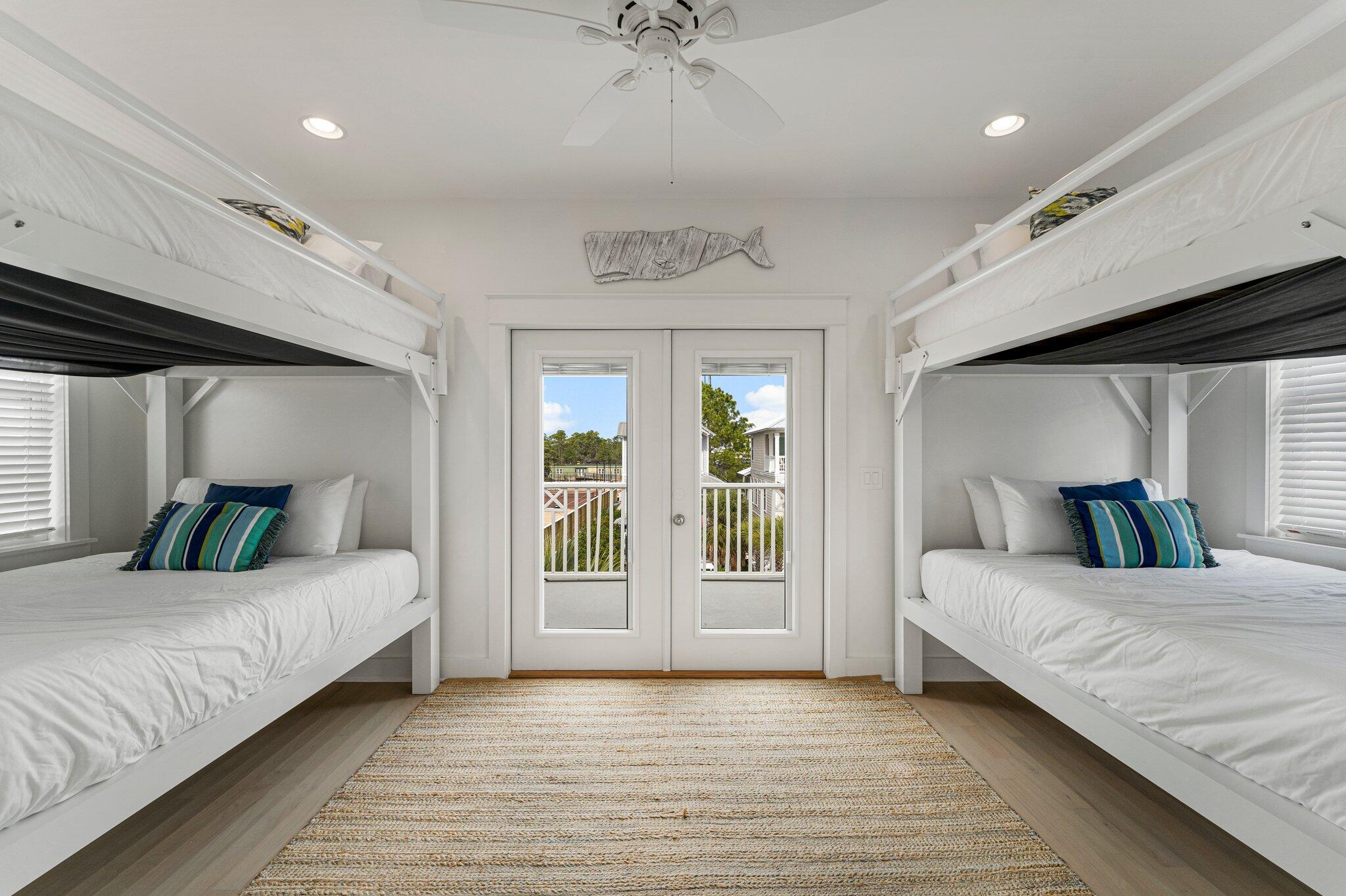 470 Beach Bike Way Inlet Beach, FL 32461 - Photo 20 of 48 a bedroom with a large bed and a chandelier