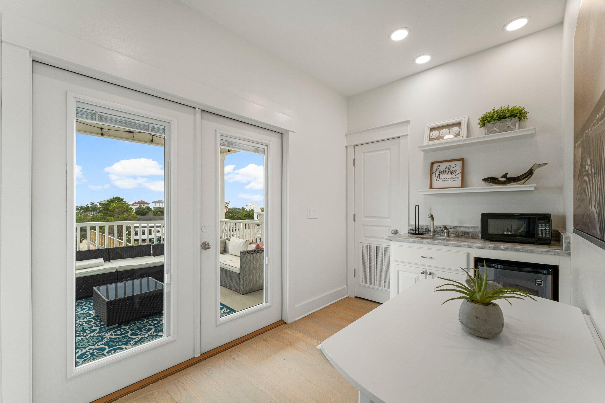 470 Beach Bike Way Inlet Beach, FL 32461 - Photo 26 of 48 a kitchen with sink cabinets and window