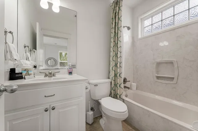 a bathroom with a sink a toilet and a bathtub