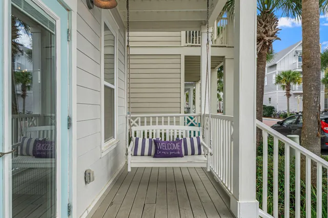 a view of a balcony with wooden floor