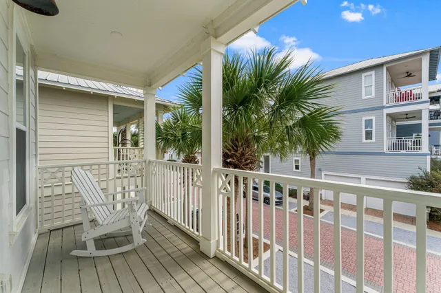 a view of a house with backyard and deck