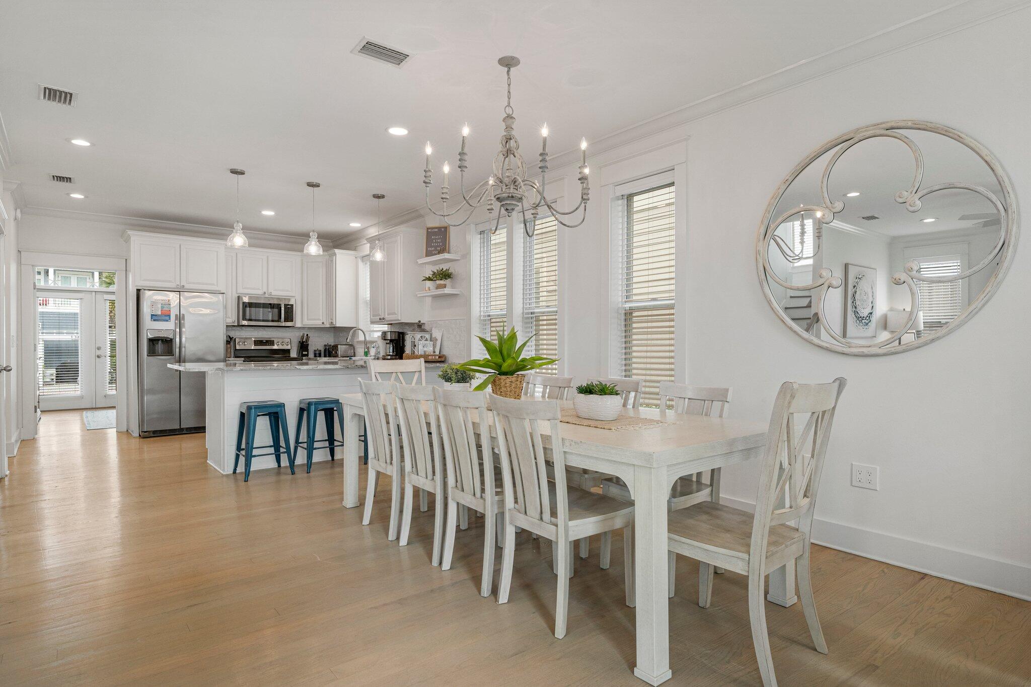 470 Beach Bike Way Inlet Beach, FL 32461 - Photo 5 of 48 a dining room with furniture a kitchen and chandelier