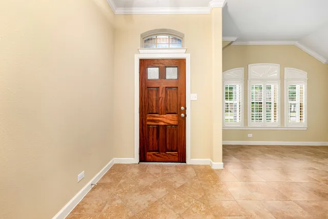 a view of a kitchen with a sink and a chandelier fan