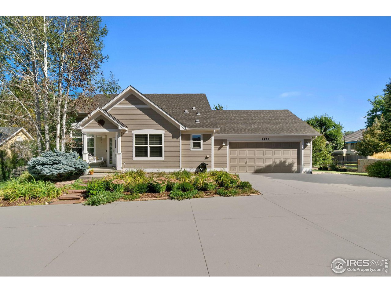2425 Windrow Lane Lafayette, CO 80026 - Photo 2 of 35 a front view of a house with a yard