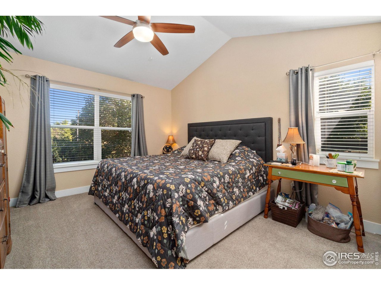 2425 Windrow Lane Lafayette, CO 80026 - Photo 21 of 35 a bed sitting in a bedroom next to a window