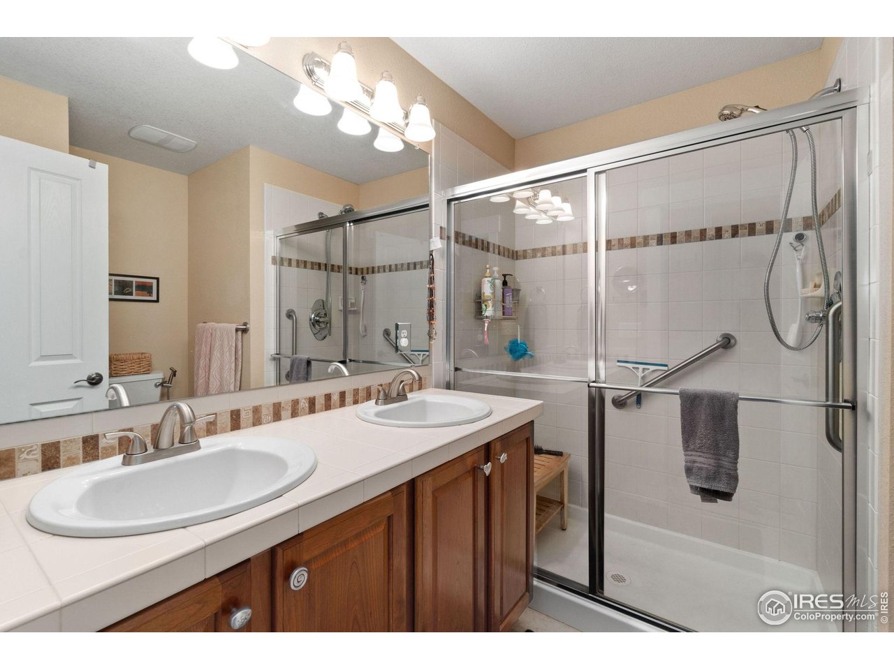 2425 Windrow Lane Lafayette, CO 80026 - Photo 23 of 35 a bathroom with a sink and a mirror