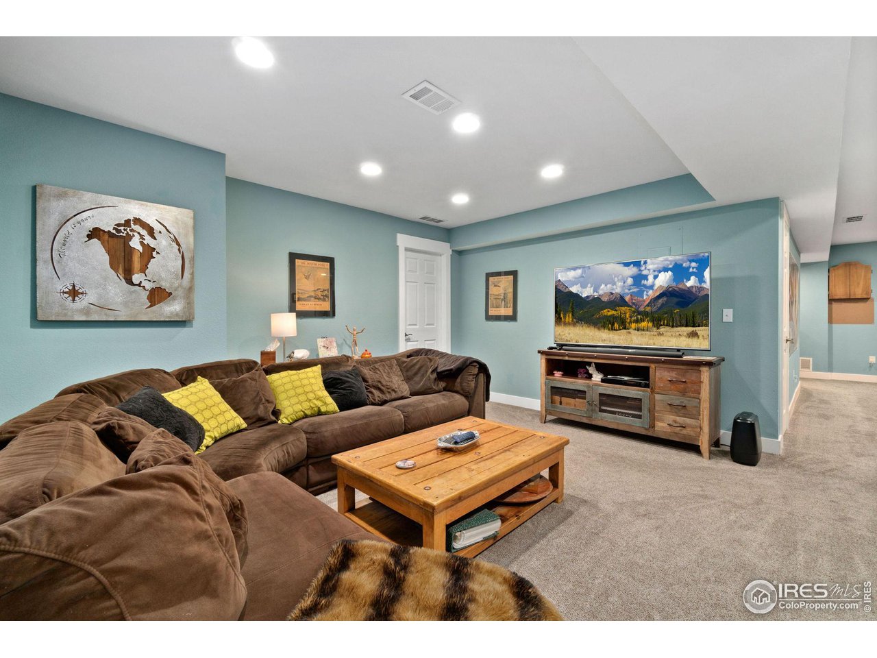 2425 Windrow Lane Lafayette, CO 80026 - Photo 28 of 35 a living room with furniture and a flat screen tv