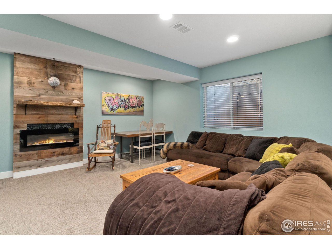 2425 Windrow Lane Lafayette, CO 80026 - Photo 29 of 35 a living room with furniture and a fireplace