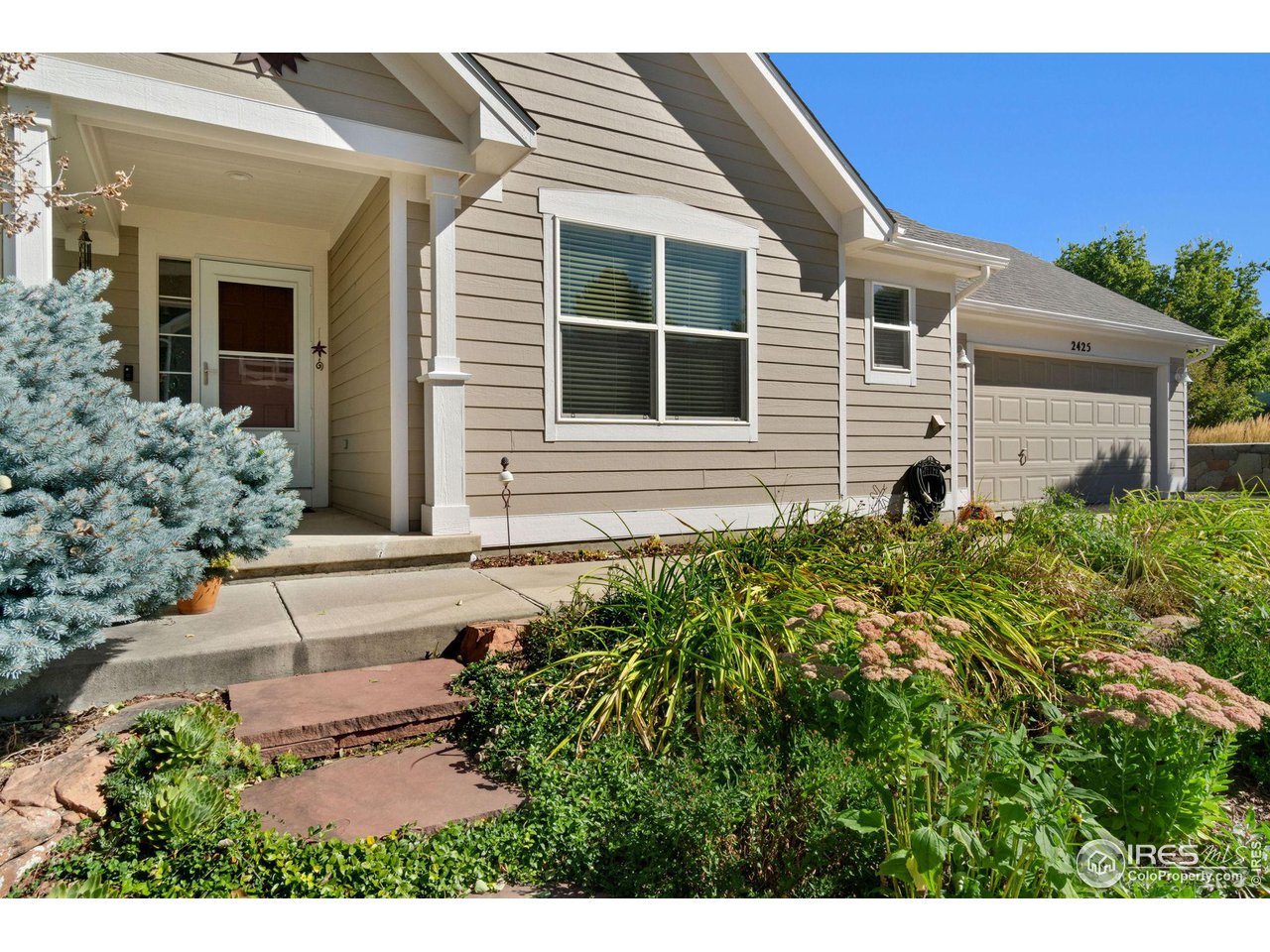 2425 Windrow Lane Lafayette, CO 80026 - Photo 3 of 35 a front view of a house with a yard