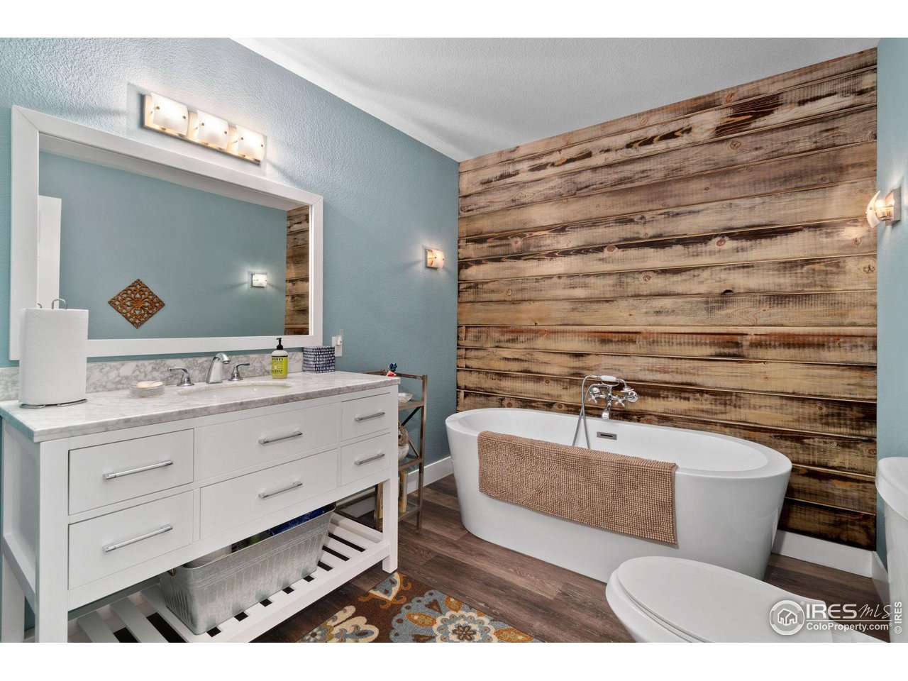 2425 Windrow Lane Lafayette, CO 80026 - Photo 31 of 35 a bathroom with a sink a toilet and mirror
