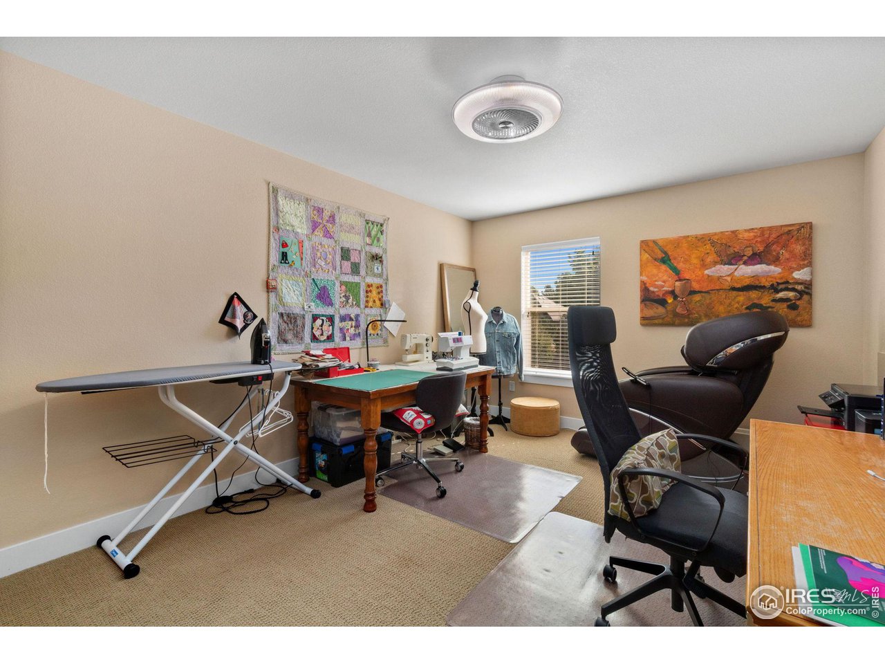 2425 Windrow Lane Lafayette, CO 80026 - Photo 32 of 35 a living room with furniture a air conditioner vent and a window