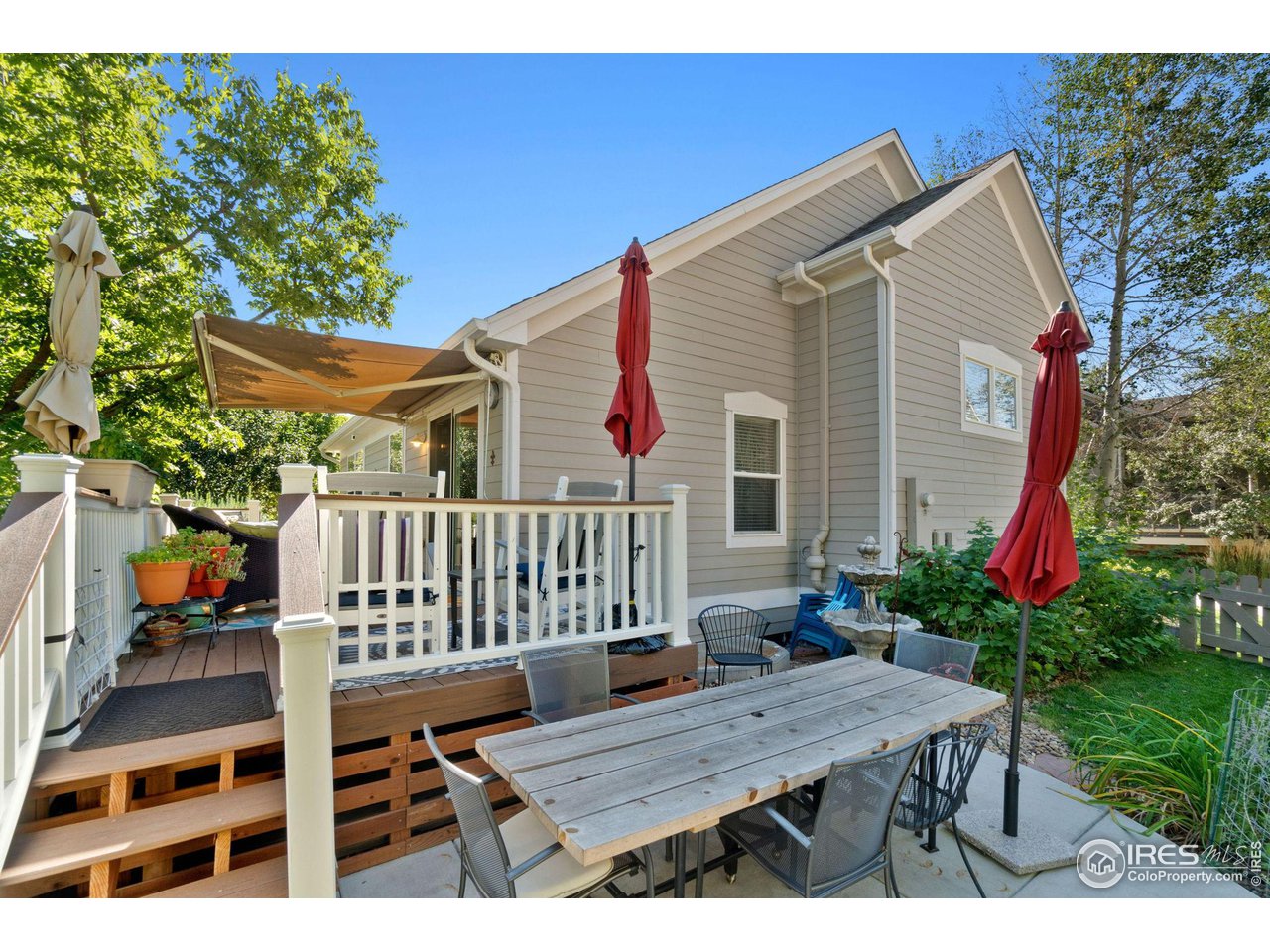 2425 Windrow Lane Lafayette, CO 80026 - Photo 33 of 35 a view of a deck with furniture and a yard