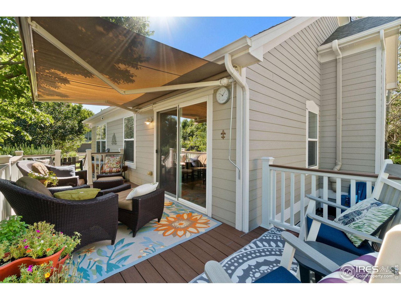 2425 Windrow Lane Lafayette, CO 80026 - Photo 35 of 35 a view of a patio with couches chairs and wooden floor