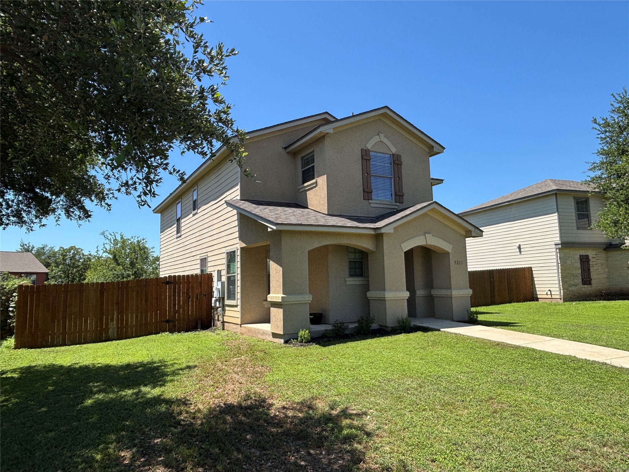 5211 Viewpoint Drive Austin, TX 78744 - Photo 1 of 25 a view of a house with yard and tree s
