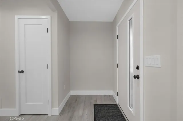 a view of room with hardwood floor