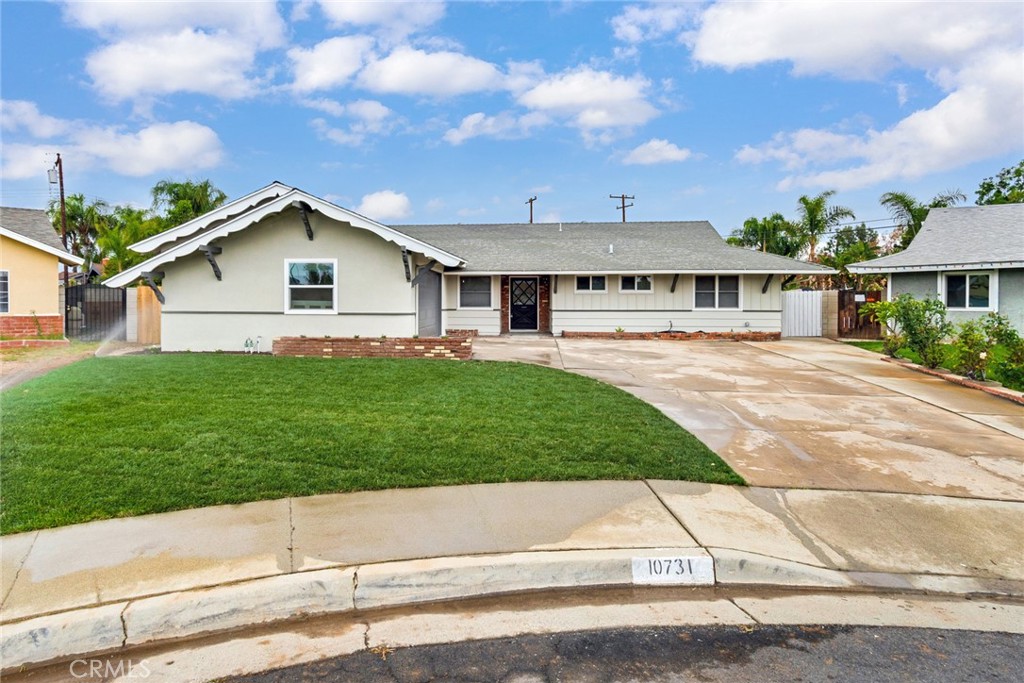 10731 Foote Court Riverside, CA 92505 - Photo 1 of 1 a front view of house with yard and green space