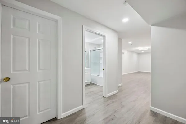 a bathroom with a glass shower door