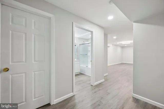 a bathroom with a glass shower door